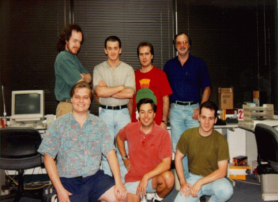 Apogee's first internal development team. Their first project: Rise of the Triad. (Top Row) Tom Hall, William Scarboro, Nolan Martin, Steven Hornback. (Bottom Row) Mark Dochtermann, Scott Miller, Tim Neveu.