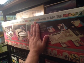John places his hand next to the gargantuan box of the Coleco Adam computer for size comparison.