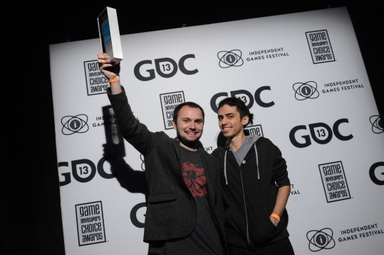 Matt Davis (left) and Justin Ma accept an award at GDC.