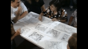 Jane Jensen (top, center) confers with a team of artists to create storyboards for King's Quest VI. (Photo credit: 
